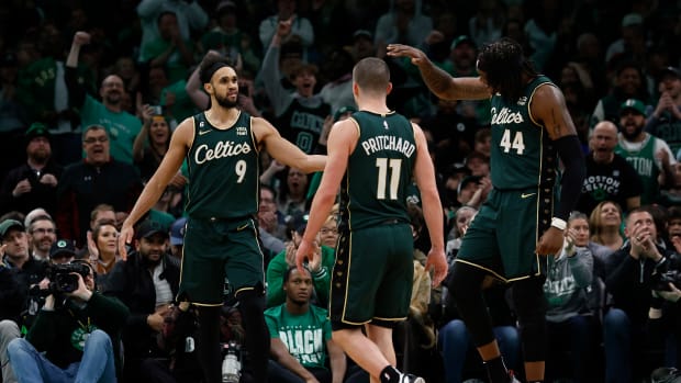 Boston Celtics guard Derrick White, guard Payton Pritchard, center Robert Williams